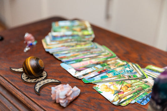 A Deck of Tarot Cards Laid Out On a Desk | Dear Universe