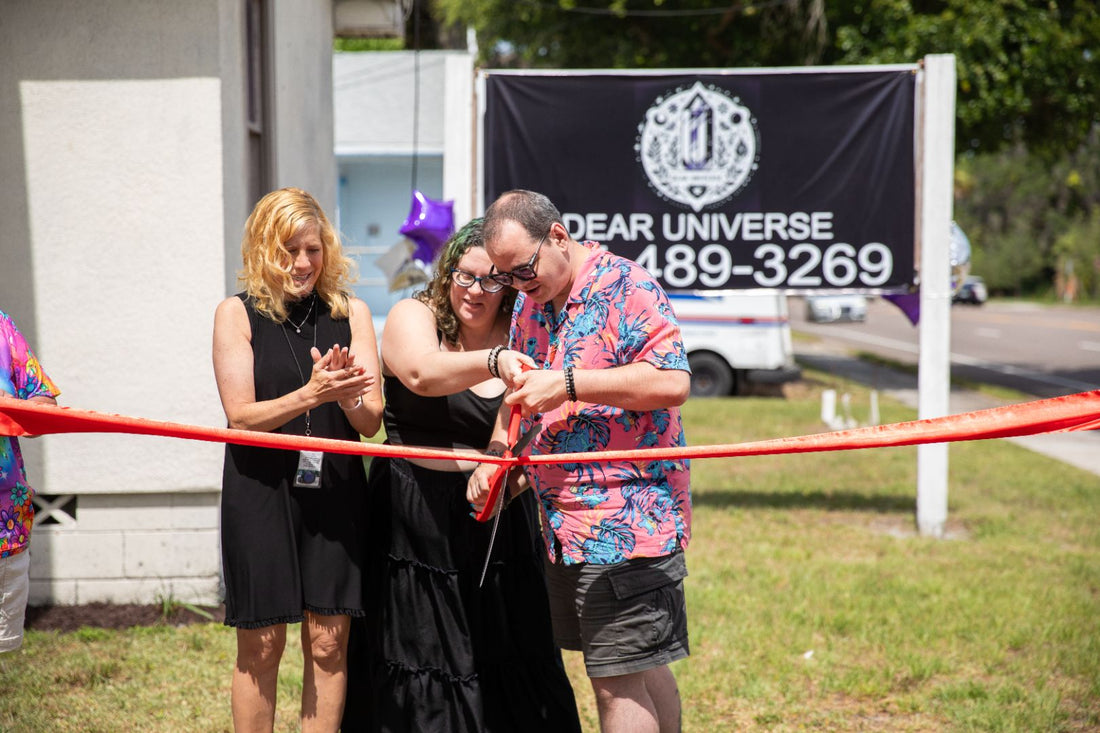 Image of the ribbon-cutting ceremony at Dear Universe's grand opening.