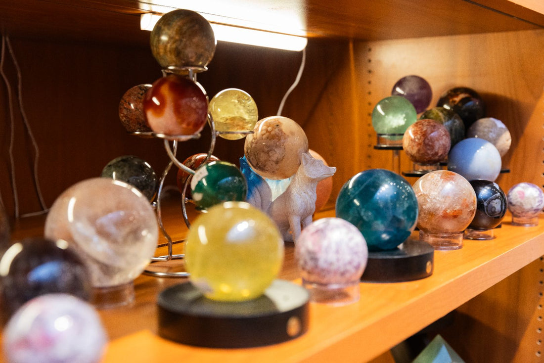 Sphere Crystals on a Wooden Lighted Shelf | Dear Universe