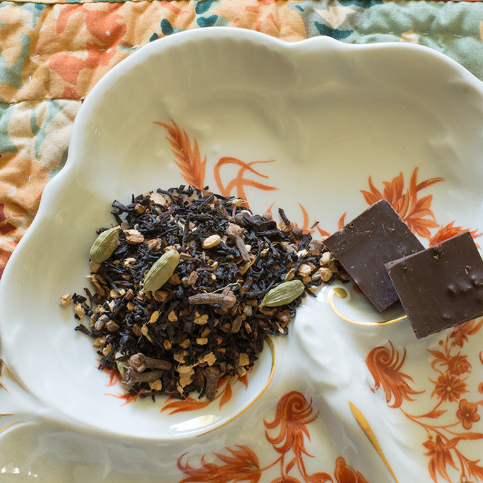 Organic Chocolate Chai Tea in a cup Loose leaf Organic Chocolate Chai Tea Steaming cup of Organic Chocolate Chai Tea Ingredients of Organic Chocolate Chai Tea Organic Chocolate Chai Tea served hot